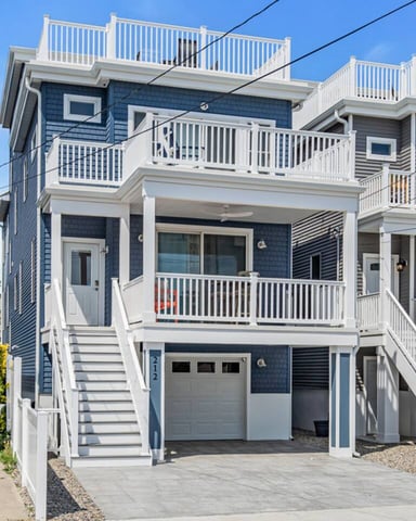 Blue shore house exterior with multiple balconies