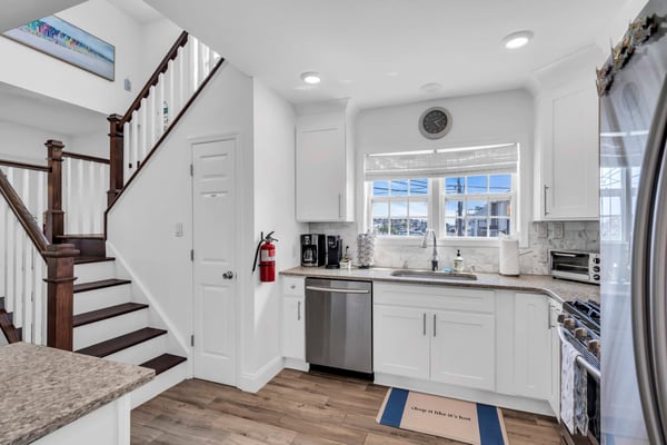 Clean, well-kept kitchen inside a Breezy Beach Stays rental home
